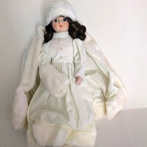 House of Lloyd 1988. Christmas Winter White Dress Doll . New in box with stand.